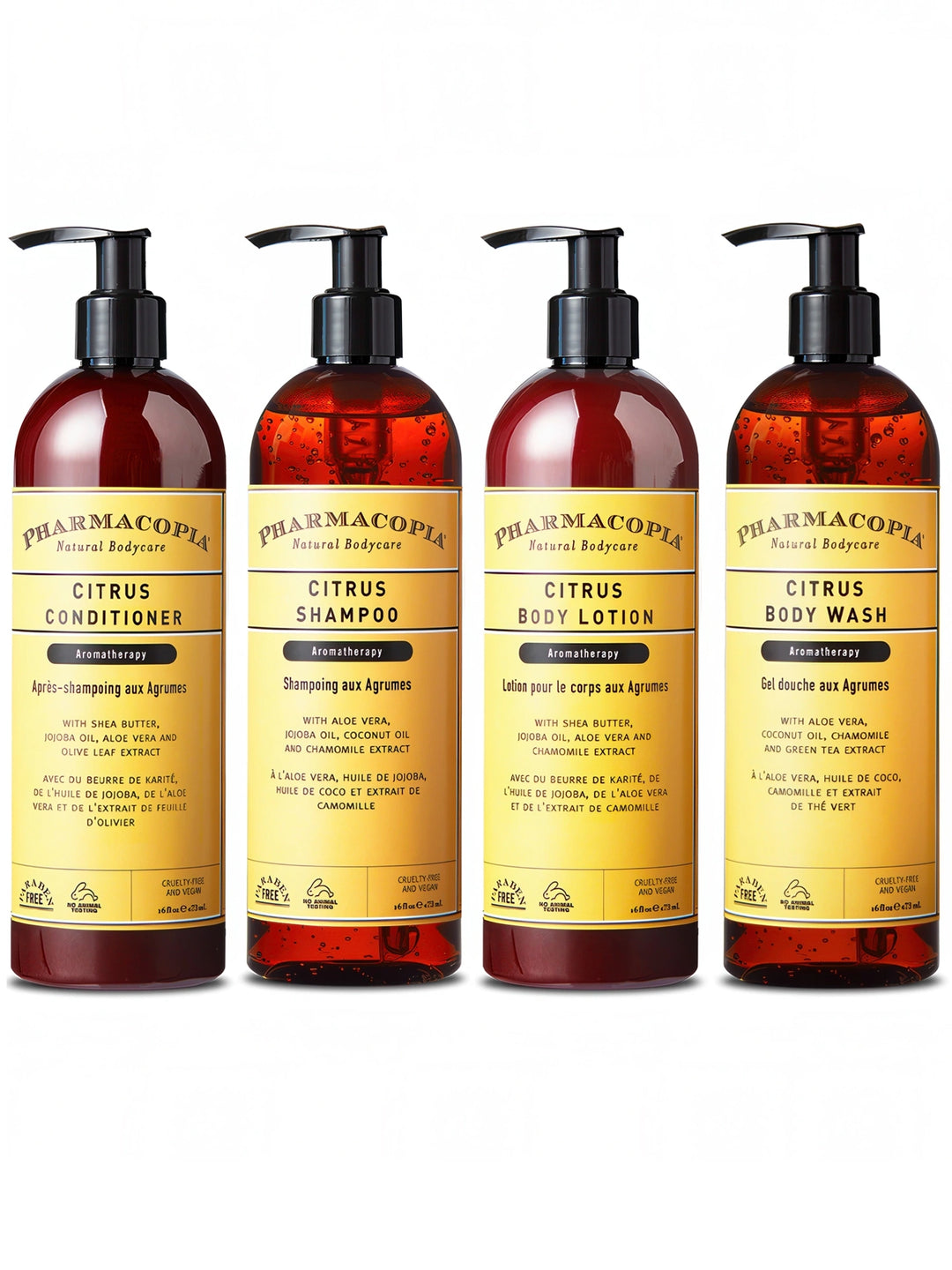 Four bottles of PHARMACOPIA hair and body products: Citrus Body Wash, Citrus Body Lotion, Citrus Shampoo, and Citrus Conditioner.